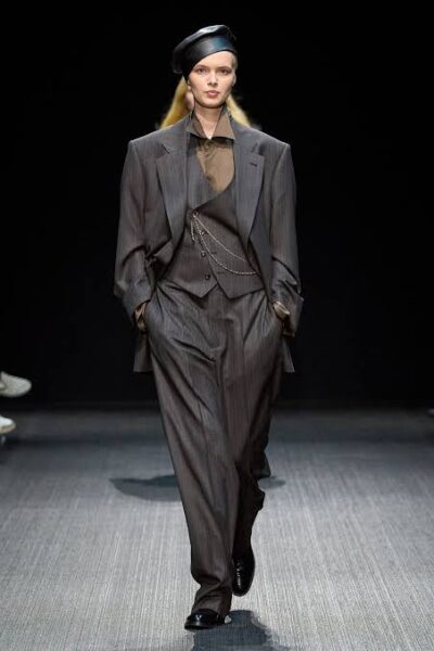 For Armani's Emporio Armani show for Fall/Winter 2022 he showed his military collection by designing military boots, jackets and belts that wrapped around the waist .