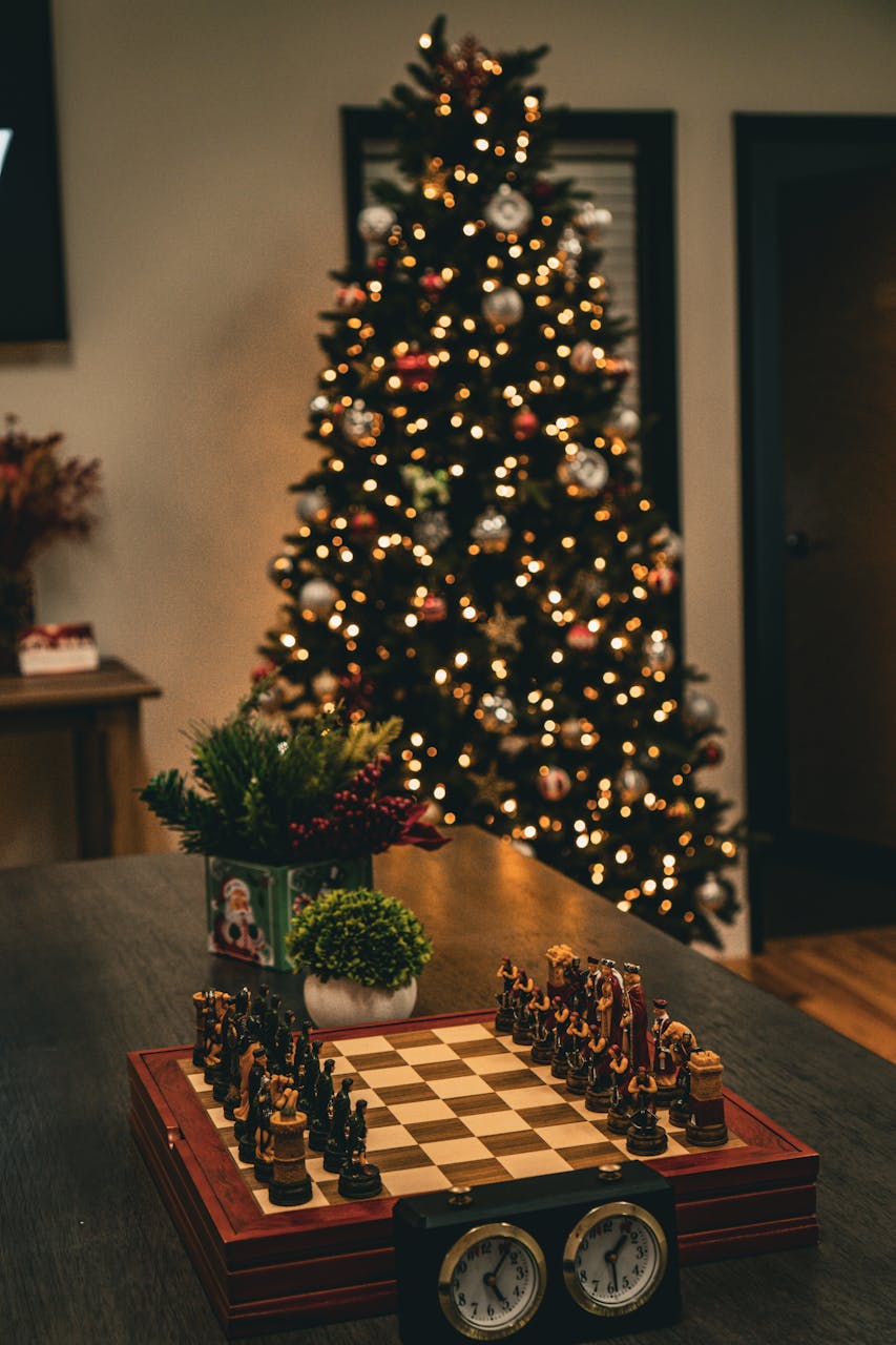 Top 5 Luxury Holiday Games to Play This SeasonCozy indoor scene featuring a decorated Christmas tree and intricate chess set on a table, perfect for holiday ambiance.