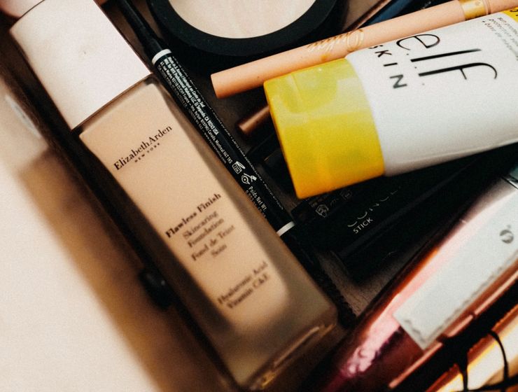 Understanding Makeup EssentialsA collection of beauty products including foundation, powder, and skincare items in a drawer.