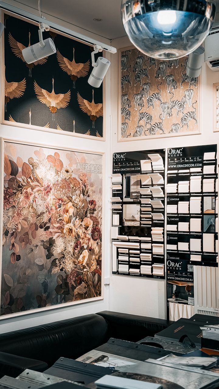 7 Interior Design Ideas That Can Make a Home Feel More SpaciousArtistic wall panels and decor in an interior design store, featuring floral and animal prints.